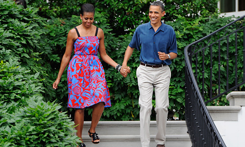 Первая леди США Мишель Обама и президент США Барак Обама во время праздника на лужайке перед Белым домом.
