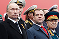 Президент РФ Владимир Путин и председатель правительства России Дмитрий Медведев во время военного Парада Победы на Красной площади.