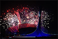 Салют над стадионом "Фишт" во время церемонии открытия XI зимних Паралимпийских игр в Сочи.