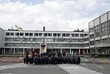 Сотрудники Чернобыльской АЭС ждут служебного автобуса возле административного корпуса