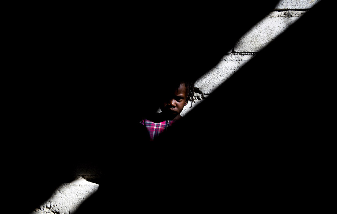 Ребенок в лагере беженцев в Порт-о-Пренсе, Гаити