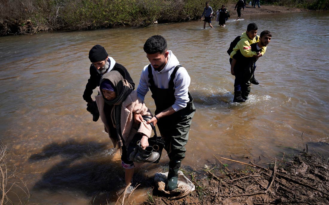 Сирийские беженцы на границе между Сирией и северным Ливаном