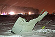 Поисковая операция на месте падения Ан-148 проходит при сильном снеге и ветре, спасатели используют снегоходы и спецтехнику